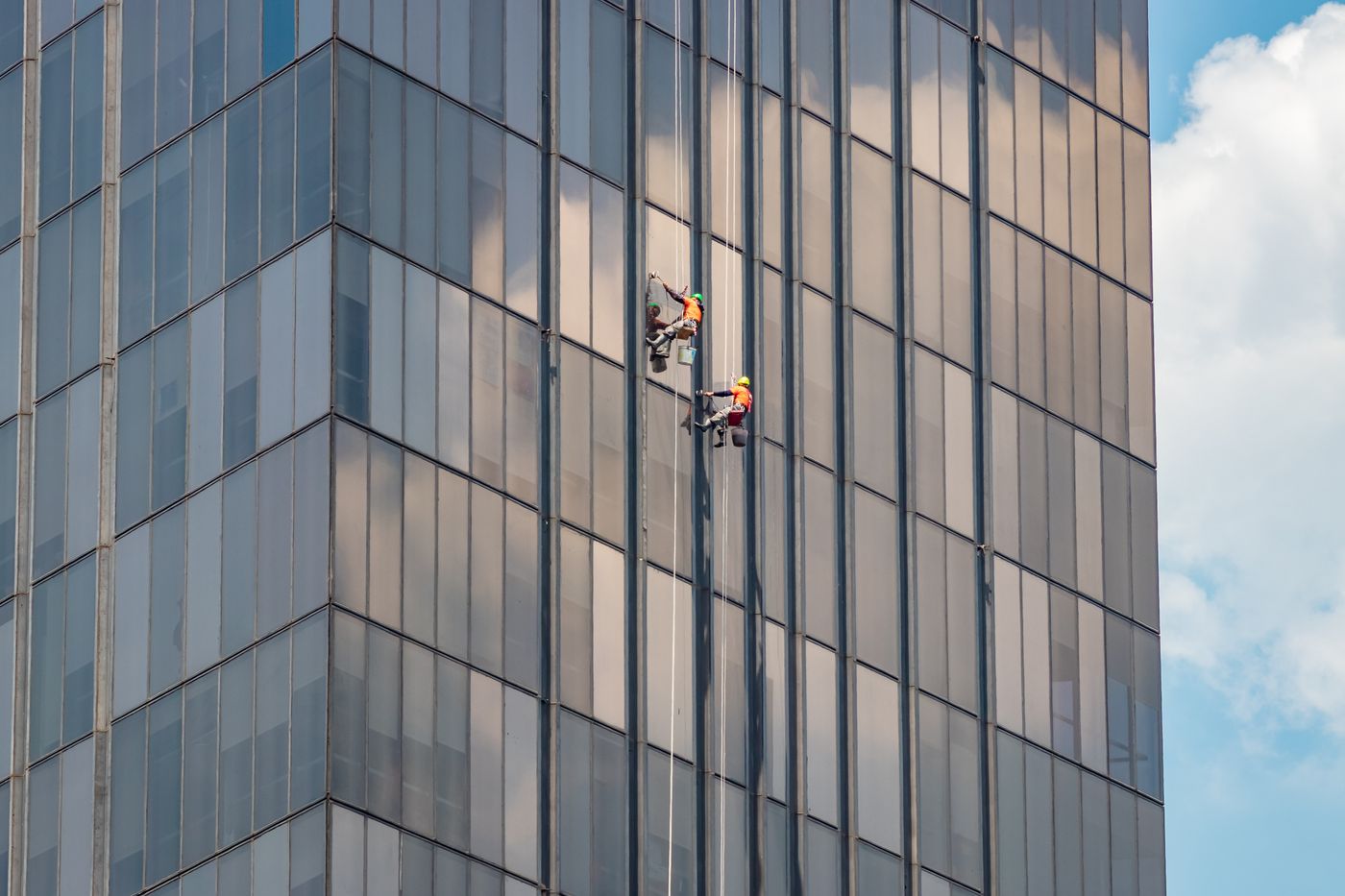 Professional cleaners working on a modern office building