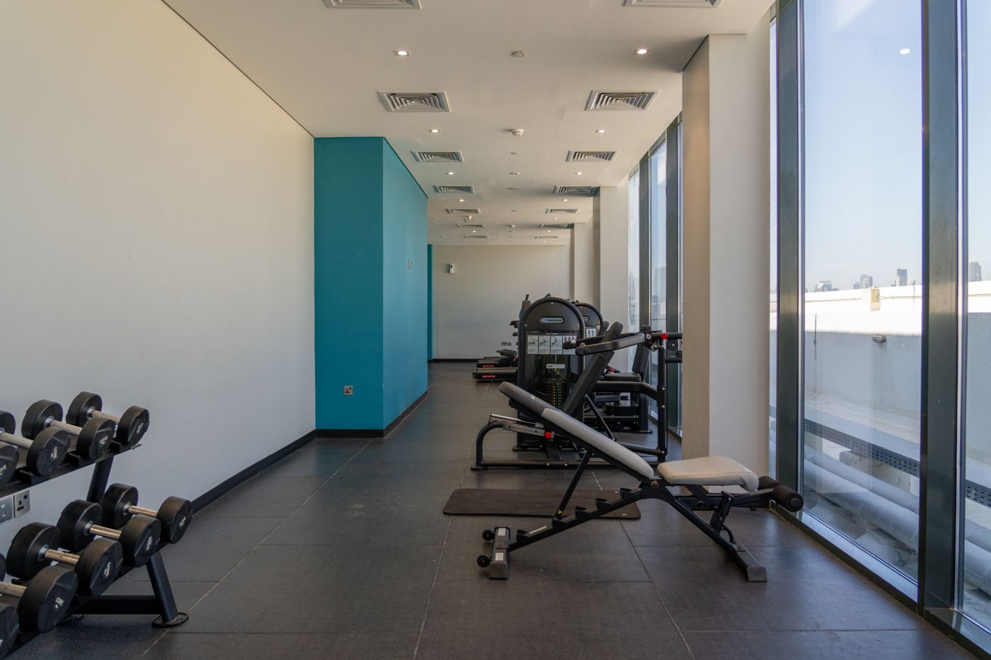 Bright modern gym with professional fitness equipment